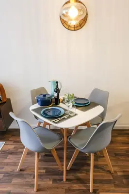 a dining room table with two chairs and a white table at Vintage Porto in Porto