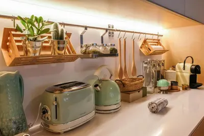 a kitchen counter with a toaster and other kitchen items at Vintage Porto in Porto
