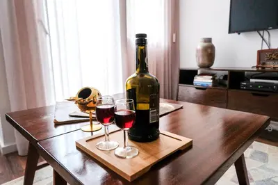 a bottle of wine and two glasses on a table at Vintage Porto in Porto