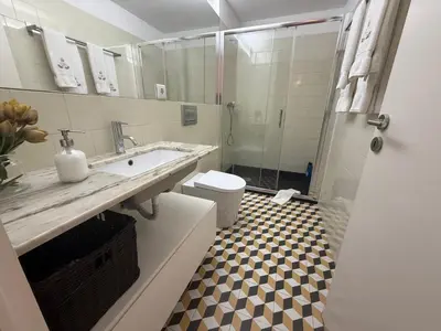 a bathroom with a toilet and a sink and a shower at ML Apartments Republic in Porto