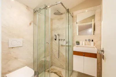 a bathroom with a shower with a toilet and a sink at RS Porto Historic Center in Porto