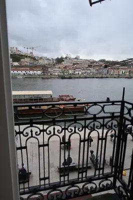 a view of a river from a balcony at Apartamentos sobre o Douro in Porto