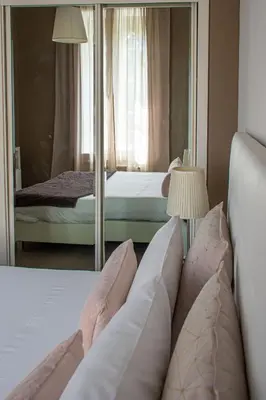 a bedroom with two beds and a mirror at O'Porto Seven - Guest House in Porto