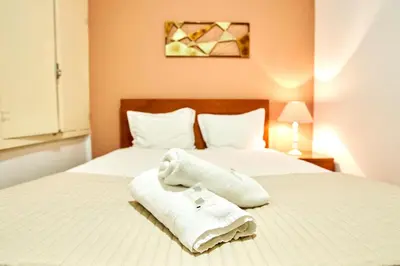 a room with a dresser and a television on a wall at Market Place (with 2 Bedrooms) by JC in Porto