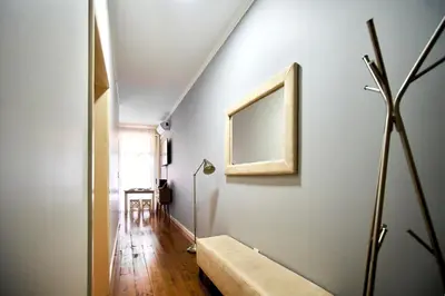 a room with a vase with a plant in it at Market Place (with 2 Bedrooms) by JC in Porto