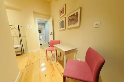 a room with four chairs and a table and a table and chairsktop at Naya-Downtown Guesthouse in Porto