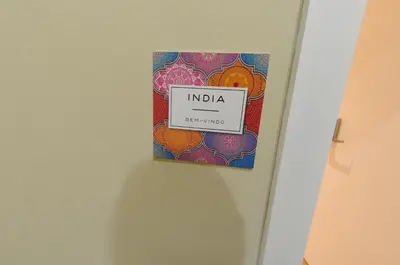 a sign that reads india hanging on a wall at Naya-Downtown Guesthouse in Porto