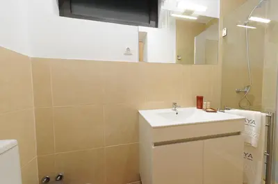 a bathroom with a sink and a mirror at Naya-Downtown Guesthouse in Porto
