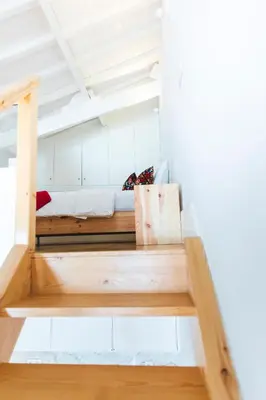 a room with a bunk bed in the ceiling at Aposentus -Romantic Mezzanine Apartment With a Balcony in Porto