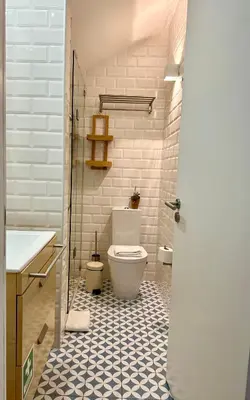 a bathroom with a toilet and a sink at 1118 Lofts in Porto