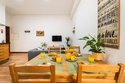 a dining room with a table with fruit on it at Porto Belo Bolhao Apartments - Free Parking in Porto