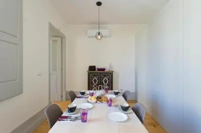 a dining room with a table with chairs at A da Maria Ildefonso in Porto