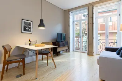 a living room with a table and a couch at Porto and Clérigos Views by Porto City Hosts in Porto