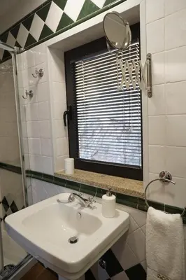 a bathroom with a sink and a mirror at Modern house - air cond, free parking, breakfast, by Porto with Love LDA in Vila Nova de Gaia