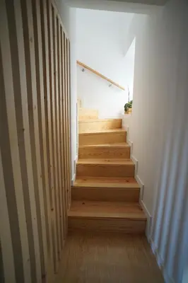 a staircase in a house with wooden floors at Modern house - air cond, free parking, breakfast, by Porto with Love LDA in Vila Nova de Gaia