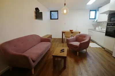 a living room with a couch and two chairs and a table at Modern house - air cond, free parking, breakfast, by Porto with Love LDA in Vila Nova de Gaia