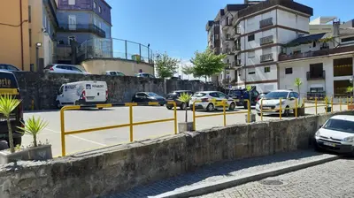 a parking lot with cars parked on a street at Modern house - air cond, free parking, breakfast, by Porto with Love LDA in Vila Nova de Gaia