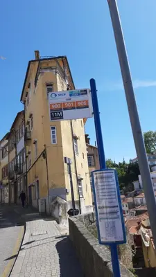 a street sign in front of a building at Modern house - air cond, free parking, breakfast, by Porto with Love LDA in Vila Nova de Gaia
