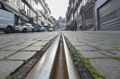 a street with a metal curb in the middle of a street at January's 31 Studio by DA'HOME in Porto