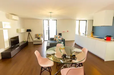 a living room with a couch and a table at Guest H4U - Bonjardim Pop Art City Center in Porto
