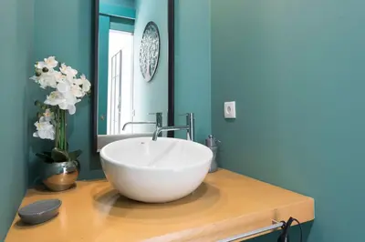 a bathroom with a large white bowl sink on a counter at LovelyStay - Wohaza Apartment with free private parking in Porto