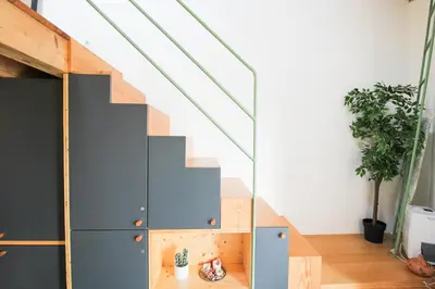 a staircase in a house with a glass wall at Macário Cosy Loft in Porto