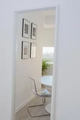 a table and a chair in a room with a mirror at Liiiving in Porto | Center Spot Apartment in Porto