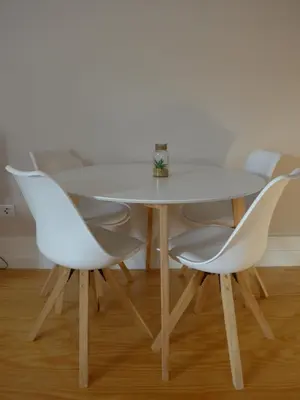 a white table and chairs with a white wall at The Porto Way in Porto