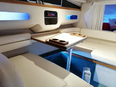 a small table in the back seat of a boat at SLEEPBOAT Barco Hotel in Porto