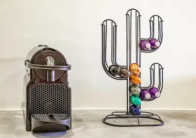 a toaster next to a wall with beads on it at Charming Bonfim Penthouse in Porto