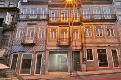 a building with a lot of windows on a street at NiP Apartment | Porto City Center Near All Sights in Porto