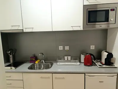 a kitchen with a sink and a microwave at Be Happy in Porto in Porto