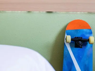a skateboard is hanging on a wall at Hotel ibis Budget Porto Gaia in Vila Nova de Gaia