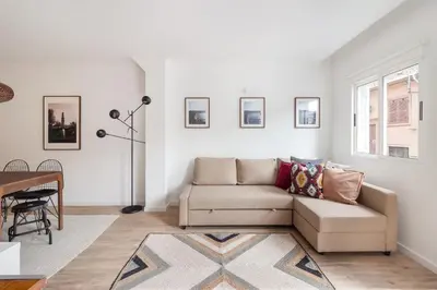 a living room with a couch and a table at Gaia Retreat • 2 BD · A/C in Vila Nova de Gaia