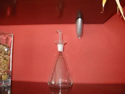 a glass vase sitting on a table with a spoon at Historic Oporto Apartment at oporto UNESCO area, in front of Porto Wine caves in Porto