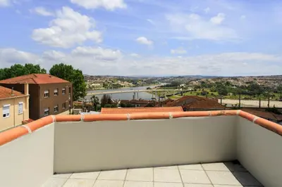 a view of a river from a balcony at Casas Da Formiga - Riverview Terrace and Pool in Porto