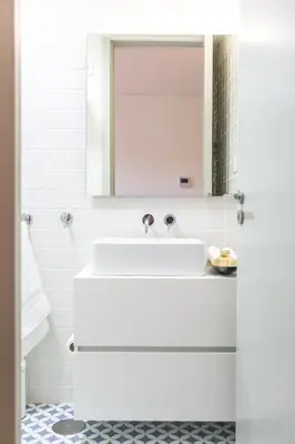 a white bathroom with a sink and a mirror at Casa D'ouro in Porto