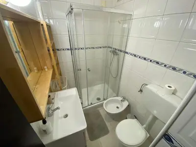 a bathroom with a shower and a toilet and a sink at Casa dos Azulejos in Porto