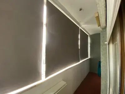 a hallway with a window with lights on the wall at Casa dos Azulejos in Porto