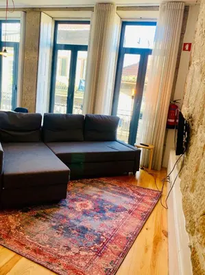 a living room with a couch and a rug at Oporto Chic&Cozy - Santo Ildefonso in Porto