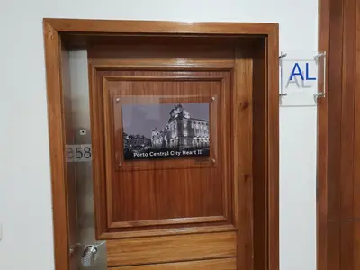 a door with a picture of a building at Porto Central City Heart I & II in Porto