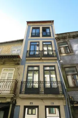 a tall building with windows and balconies on it at VIVA Historic Centre Downtown in Porto