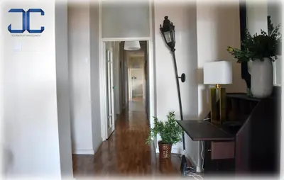 a hallway of a living room with a table and a lamp at Pardal Apartment by JC in Porto