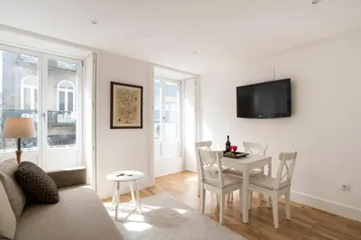 a living room with a couch and a table at Casa do Poeta in Porto
