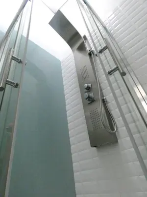 a shower in a bathroom with a glass wall at Cor Iesu House, Arts Quarter, Porto in Porto