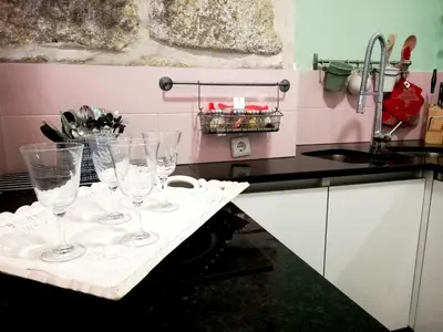 a group of wine glasses sitting on a counter in a kitchen at Cor Iesu House, Arts Quarter, Porto in Porto