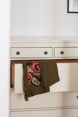 a white dresser with a towel hanging from it at LovelyStay - Aurora Heights Apartment in Porto