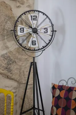 a clock on a tripod in a room at Casa Sá Noronha Old Town in Porto