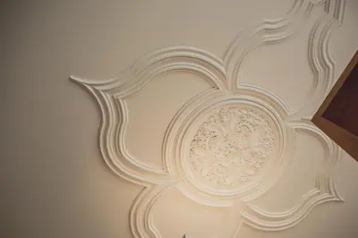 a white ceiling with a fancy design on a wall at viterbo'8 - The Artists House in Porto