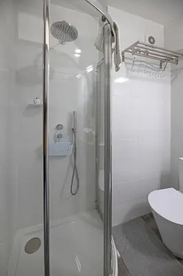 a bathroom with a shower and a toilet at FLH Porto Spacious Apartment with Balcony in Porto